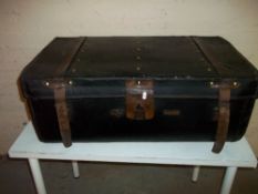 A LEATHER BOUND STORAGE / TRAVEL TRUNK BY R. CLAMP & SON