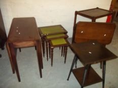 FIVE ITEMS INCLUDING AN OAK SERVING TROLLEY, FOLDING TABLE, A DROP LEAF TABLE, A LEATHER INLAID NEST
