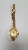 A LADIES 9 CT GOLD AVIA WATCH WITH INTEGRAL STRAP
