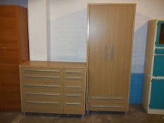 A MODERN TWO PIECE BEDROOM SUITE COMPRISING A TEN DRAWER CHEST AND TWO DOOR WARDROBE