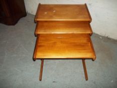 A VINTAGE RETRO TEAK NEST OF THREE TABLES