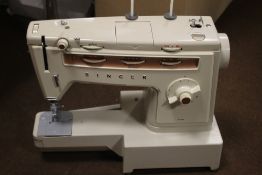 A CASED SINGER SEWING MACHINE