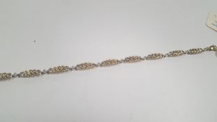 A 9 CT GOLD DIAMOND BRACELET