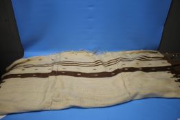 A VINTAGE THREE PANEL BROWN AND CREAM KILIM RUG