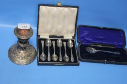 A QUANTITY OF SILVER ITEMS TO INCLUDE A CANDLESTICK, SPOONS, SUGAR TONGS ETC.