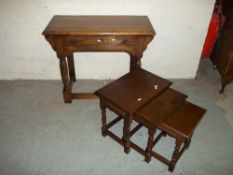 A SOLID OAK HALL TABLE AND A NEST OF TABLES