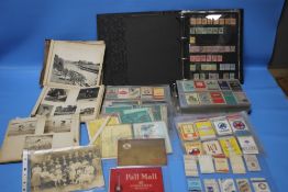 A COLLECTION OF STAMPS, PHOTOGRAPHS, CIGARETTE CARDS ETC.