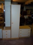A THREE PIECE MODERN BEDROOM SUITE COMPRISING A SINGLE DOOR WARDROBE, AND TWO THREE DRAWER CHESTS