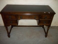 A LEATHER INLAID OAK DESK
