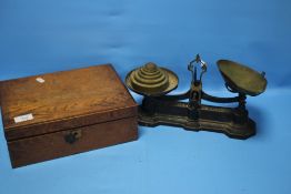 A SET OF AVERY SCALES AND WEIGHTS AND A WRITING SLOPE