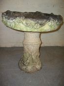 A CONCRETE BIRD BATH