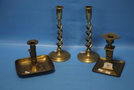 FOUR BRASS CANDLESTICKS
