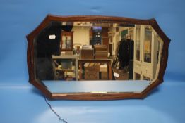 AN OAK FRAMED MIRROR APPROX. 66 X 40 CM