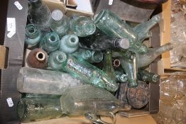 A BOX OF VINTAGE GLASS BOTTLES