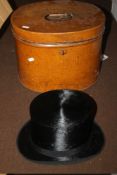 A METAL HAT BOX WITH A BLACK TOP HAT (NO MAKER 'BEST QUALITY' LONDON)