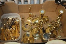 A TRAY OF BRASSWARE TO INCLUDE TWO TWISTED CANDLESTICKS AND A SET OF GOLD PLATED CUTLERY (TRAY NOT