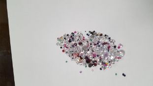A BAG OF LOOSE, MIXED STONES INCLUDING CUBIC ZIRCONIA, SAPPHIRE, RUBY EMERALD, GARNETAND AMETHYST,