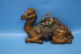 AN ANTIQUE COLD PAINTED INKWELL IN THE FORM OF A CAMEL WITH SADDLE