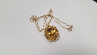 AN ANTIQUE YELLOW METAL AND CITRINE PENDANT ON LATER GOLD CHAIN