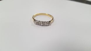 AN 18 CT GOLD FIVE STONE DIAMOND RING