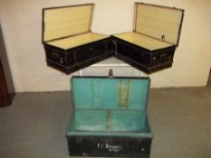 THREE METAL STORAGE TRAVEL TRUNKS
