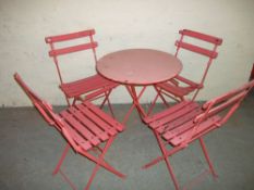 A FOLDING GARDEN PATIO SET WITH FOUR CHAIRS