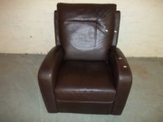 A BROWN LEATHER MANUAL RECLINER CHAIR.