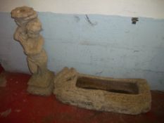 A DECORATIVE PLANT TROUGH AND A STATUE IN CONCRETE