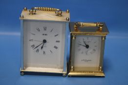 A TWO THOUSAND MILLENIUM CARRIAGE CLOCK TOGETHER WITH ANOTHER (2)