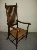 AN ANTIQUE COUNTRY OAK STLE CARVER CHAIR 1920S