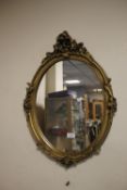 A GILT FRAMED MIRROR APPROX 66 X 48 CM