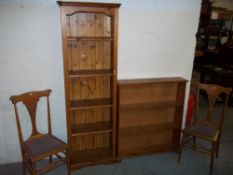 A TALL NARROW PINE BOOKCASE, TWO CHAIRS, A PIANO STOOL AND A LOW WIDE PINE BOOKSHELF
