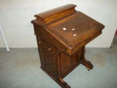 A LEATHER INLAID DAVENPORT WRITING DESK MADE BY RAY & MILES