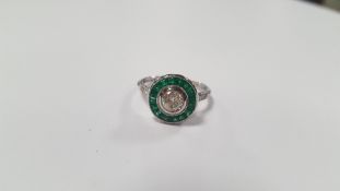 A PLATINUM EMERALD AND DIAMOND TARGET-STYLE RING, CENTRAL RBC DIAMOND APPROX. 0.44 CT,