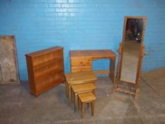 FOUR ITEMS INCLUDING A PINE SWIVEL DRESSING MIRROR, A PINE LOW BOOKSHELF, A PINE DESK AND AN OAK