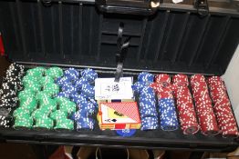 A CASED SET OF POKER CHIPS