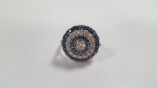 A PLATINUM SAPPHIRE AND DIAMOND RING, DIAMONDS APPROX. 0.78 CT, CALIBRE CUT SAPPHIRES APPROX. 2.35
