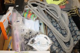 A SMALL TRAY OF COAT HANGERS, RUG ETC.