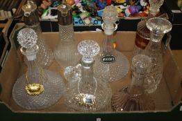 A TRAY OF CUT GLASS DECANTERS SOME WITH DECANTER LABELS (TRAY NOT INCLUDED)
