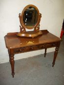 A TWO DRAW DESK AND SWIVEL MIRROR