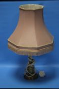 A BRASS LAMP WITH SHADE