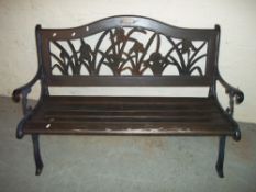 A CAST IRON GARDEN BENCH