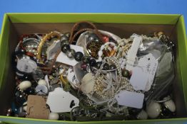 A BOX OF COSTUME JEWELLERY