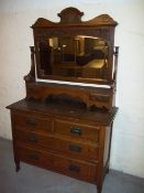 AN ANTIQUE OAK DRESSING TABLE