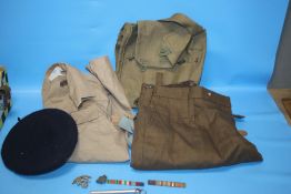 A COLLECTION OF MILITARY TYPE CLOTHING AND A SMALL COLLECTION OF PIN BADGES ETC.