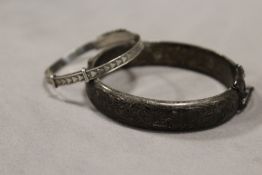 A HALLMARKED SILVER ENGRAVED BANGLE, TOGETHER WITH A CHRISTENING BANGLE (2) APPROX WEIGHT - 25.2G