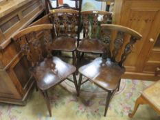 A SET OF FOUR ERCOL 'FLEUR DE LYS' CHAIRS