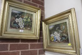 A PAIR OF GILT FRAMED AND GLAZED OIL ON CANVAS PAINTINGS DEPICTING STILL LIFE ON A MOSSY BANK SIGNED