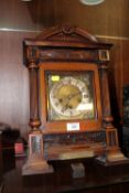 AN ANTIQUE CARVED MAHOGANY BRACKET CLOCK BY JUNGHANS, STRIKING ON BARS, A/F