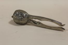 A WEST GERMAN STYLE NUTCRACKER AND BOTTLE OPENER, STAMPED BMF